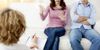 A woman's torso as she explains something